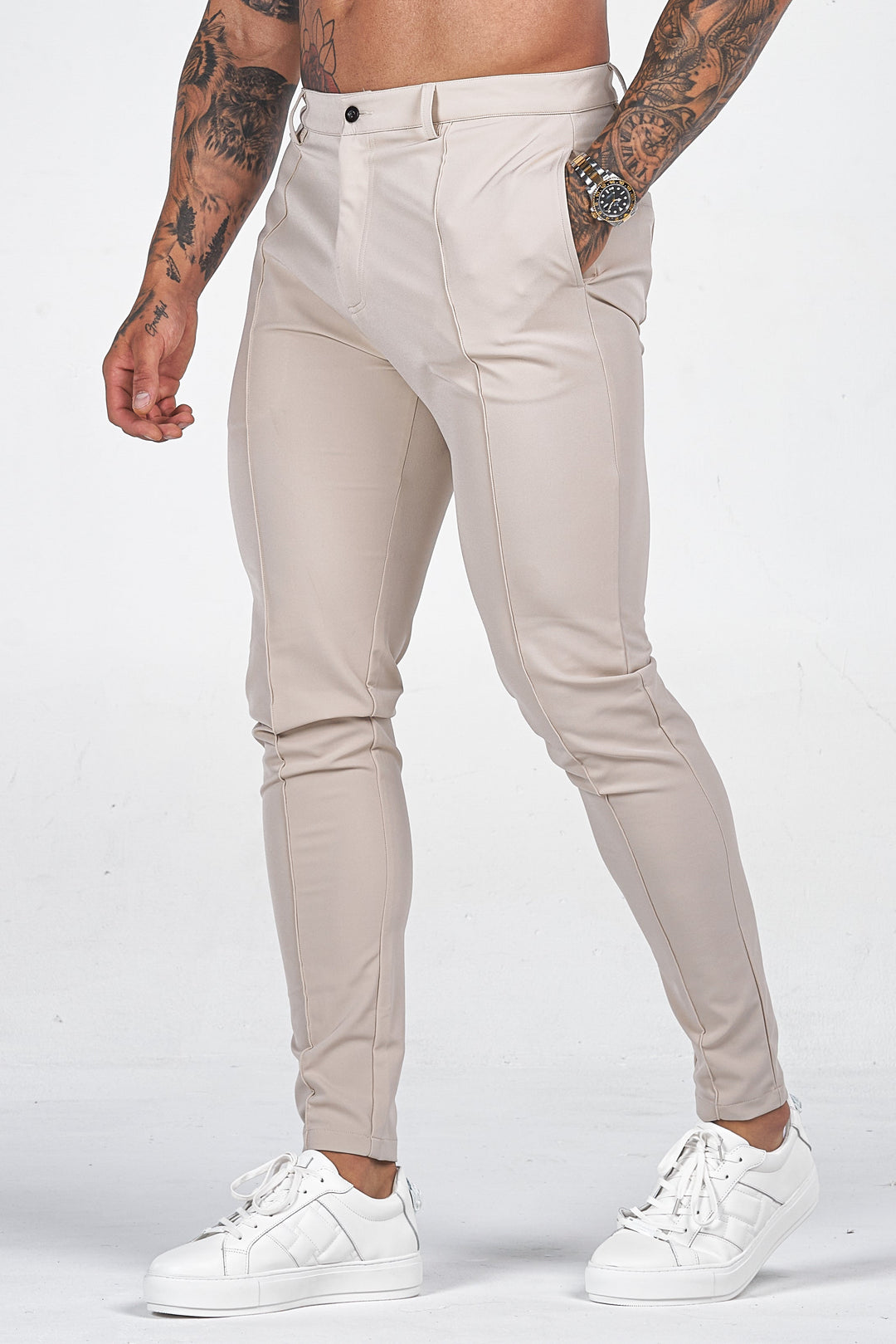 Men's stylish slim fit chino trousers in a neutral color, perfect for smart casual or dressy occasions.