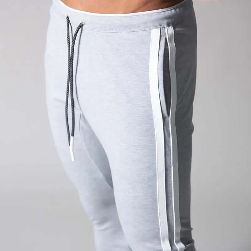 Distinctive stripe pattern on men's modern skinny pants, suitable for casual & outdoor fashion statements.