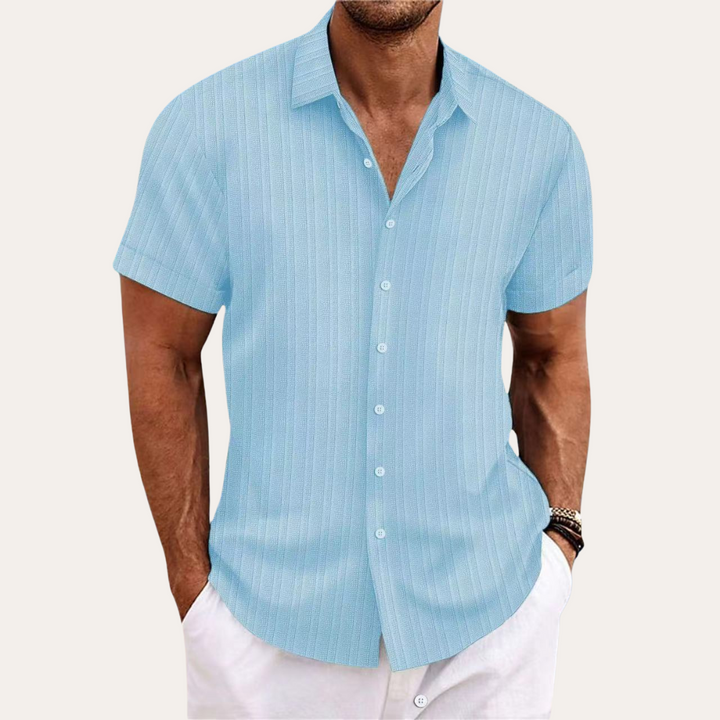 Stylish men's short-sleeve collared shirt featuring a crisp striped pattern and practical button-down front.