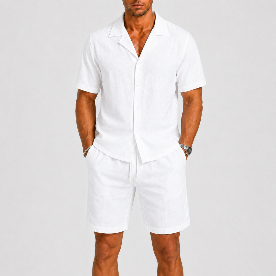 Relaxed fit men's vacation style set: matching shirt & shorts with elastic waist, perfect for travel.