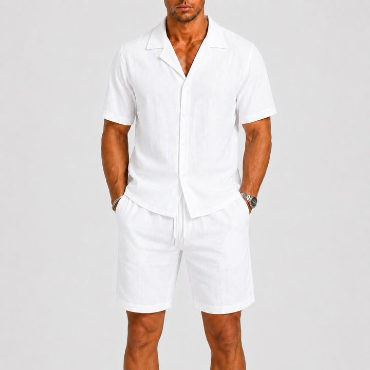 Relaxed fit men's vacation style set: matching shirt & shorts with elastic waist, perfect for travel.