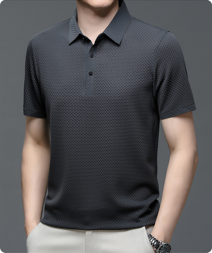 Hem detail of a men's lightweight polo shirt, ensuring comfort and casual style for summer fashion.