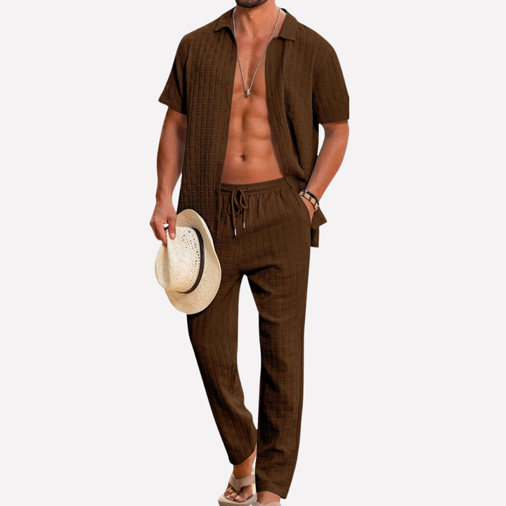 Comfortable men's textured summer shirt & relaxed trousers two-piece set for casual style.