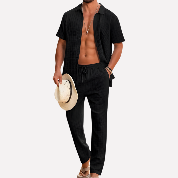 A men's summer textured shirt paired with matching relaxed trousers, ideal for vacation.