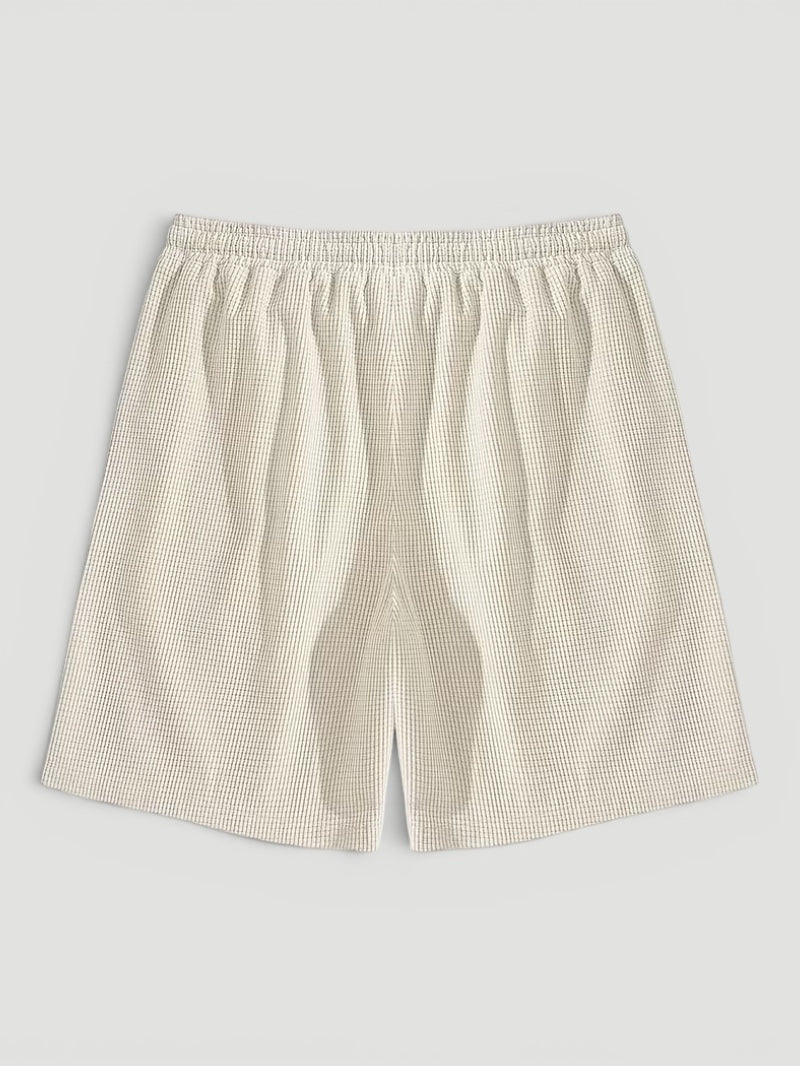 Relaxed fit men's textured shorts with drawstring for ultimate summer comfort & beachwear style.