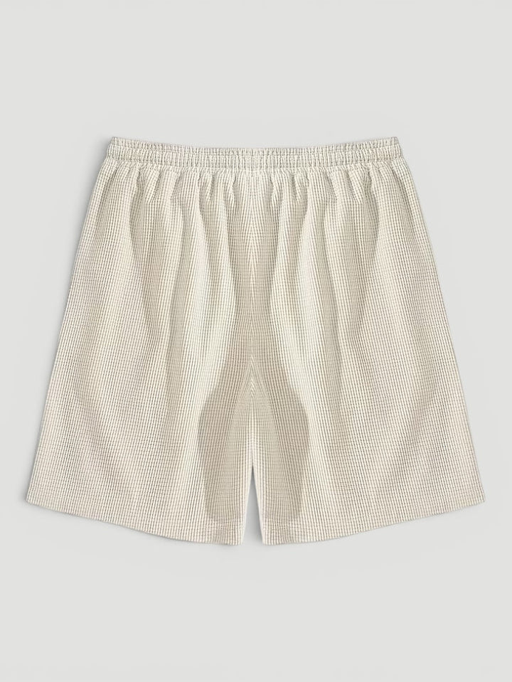 Relaxed fit men's textured shorts with drawstring for ultimate summer comfort & beachwear style.