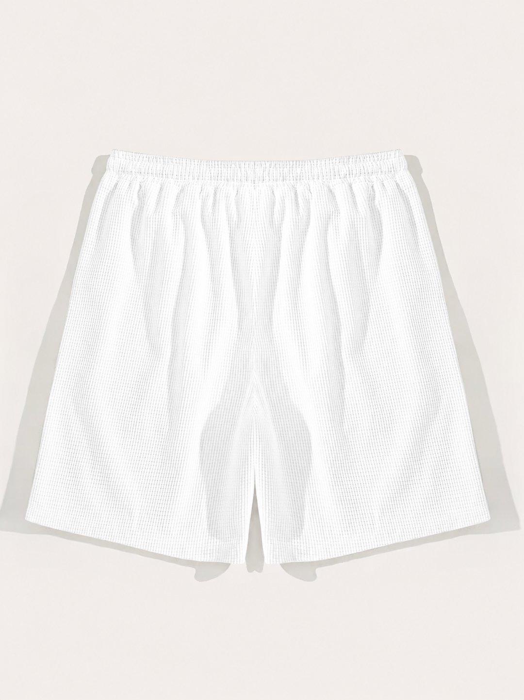 Comfortable men's casual shorts, textured with a drawstring. Essential relaxed fit summer beachwear.