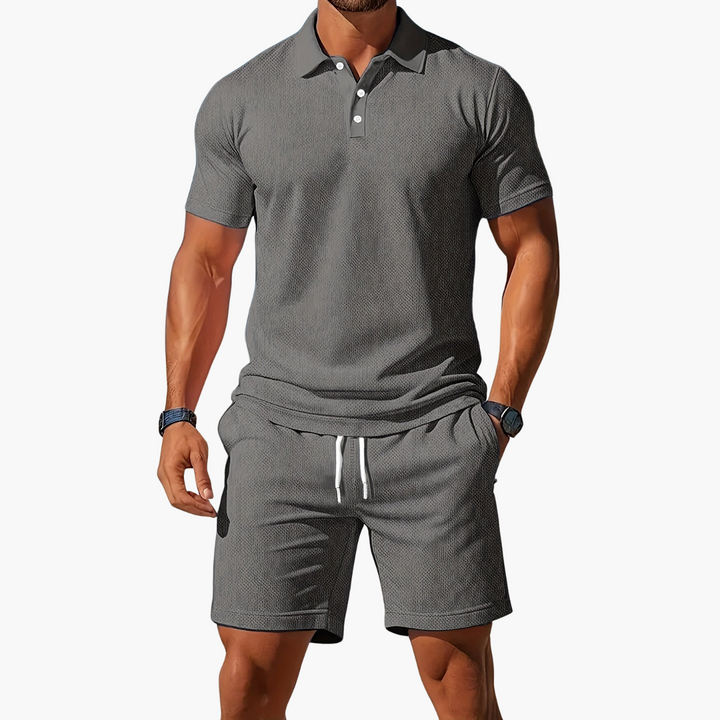Light pink men's coordinated polo and shorts set. Trendy summer fashion for men's resort wear.