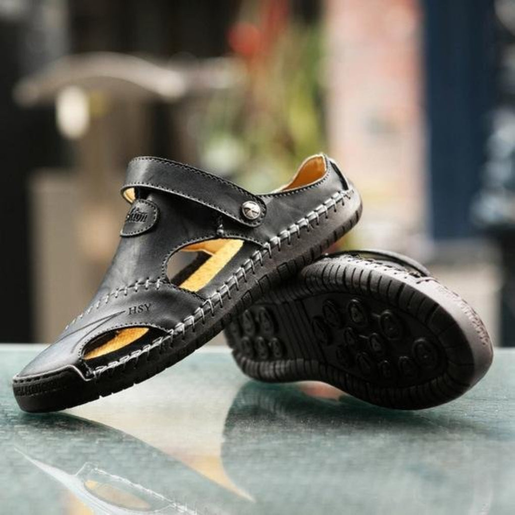 Men's summer sandals with cut-out design & adjustable strap. Perfect for casual wear & outdoor comfort. Durable sole.