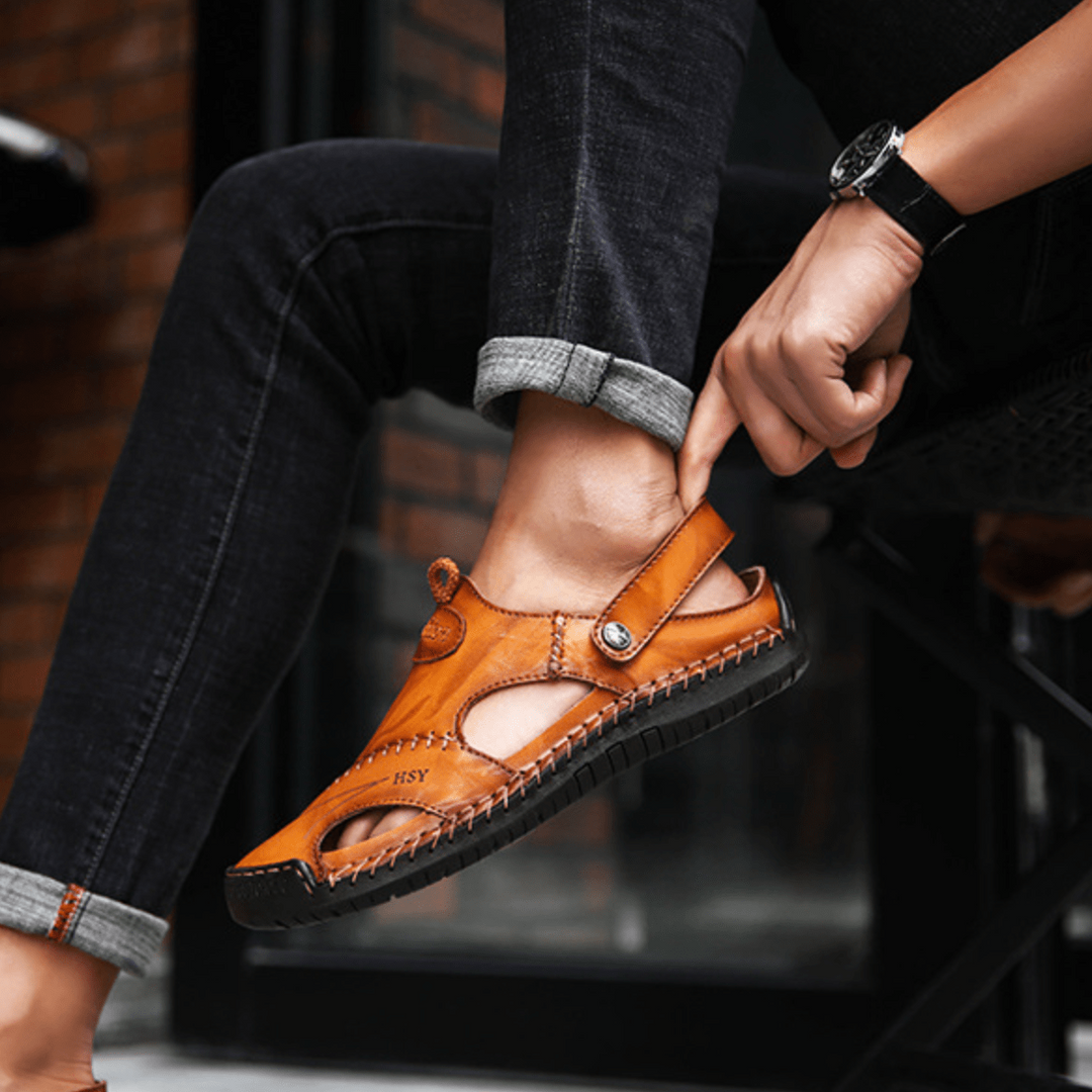 Comfortable men's summer sandals with adjustable strap & unique cut-out design. Durable outdoor footwear for active men.