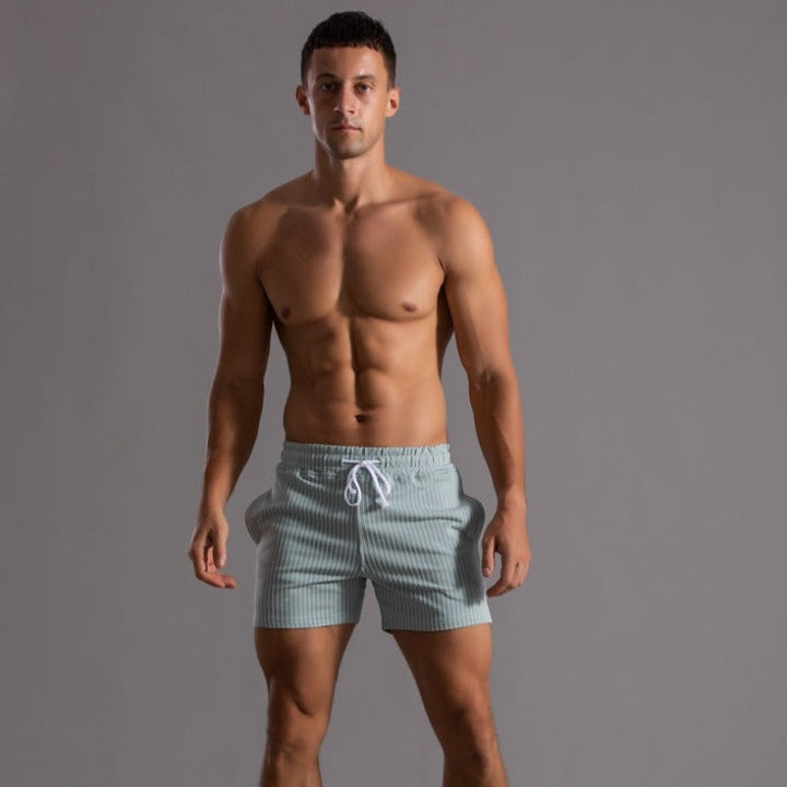 Men's athletic shorts, designed for summer workouts, beach sports & casual everyday wear. Active lifestyle.