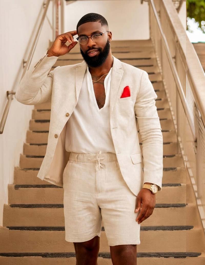 Elegant men's resort wear: a tailored blazer paired with comfortable drawstring shorts for sophisticated style.