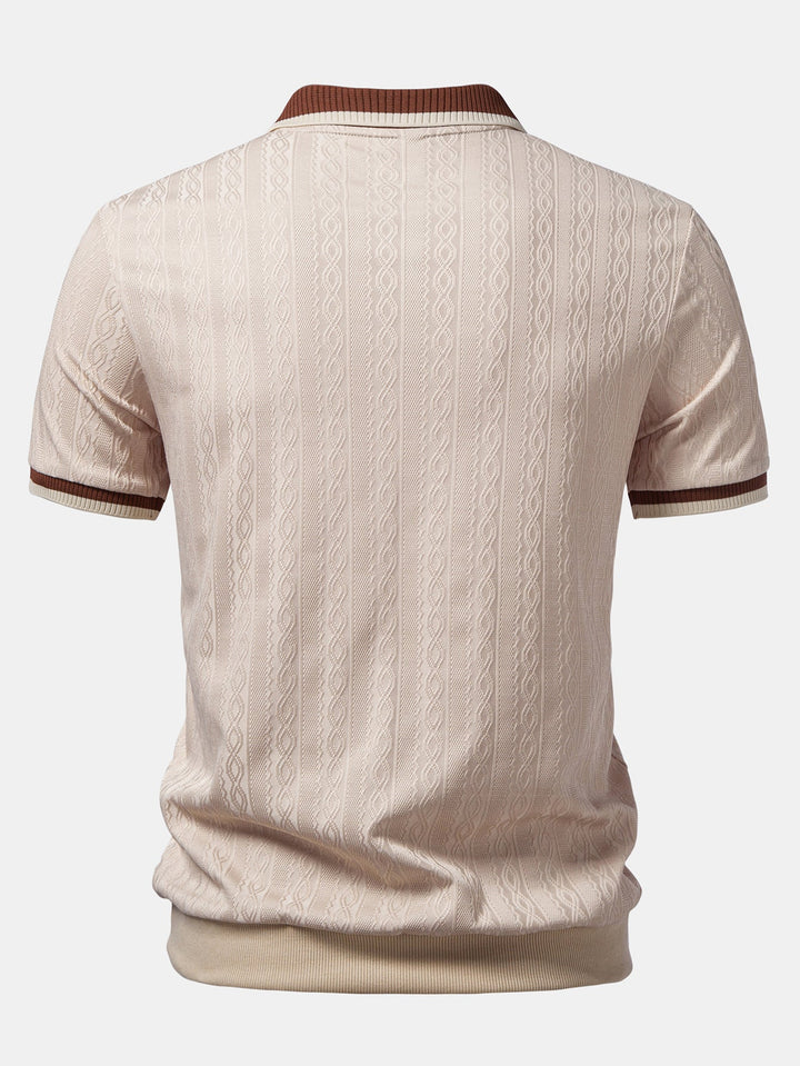 Refined men's short-sleeve polo with tailored fit, quarter-zip closure & subtle textured knit for smart casual look.