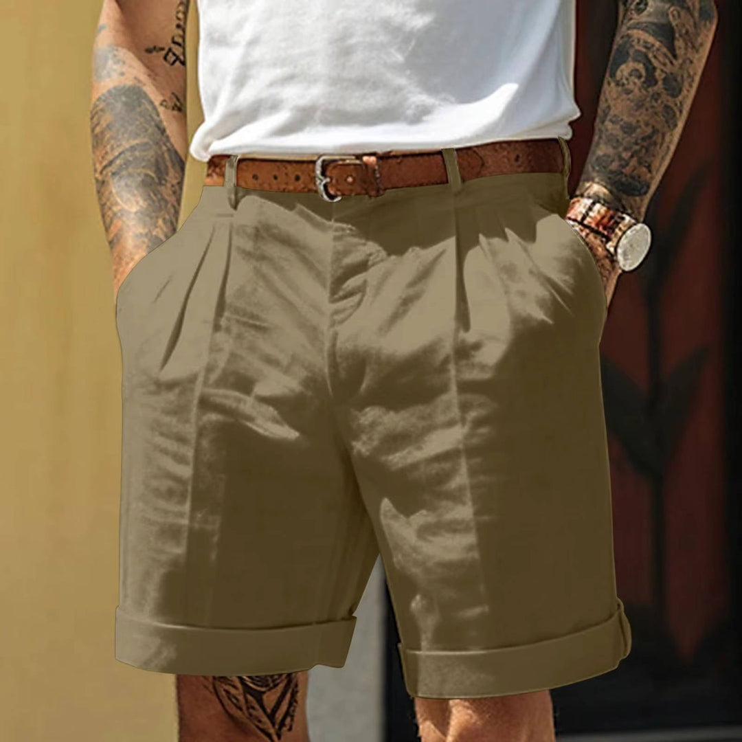 Olive green men's tailored pleated shorts. Features refined fit, turn up hem, perfect for summer style.