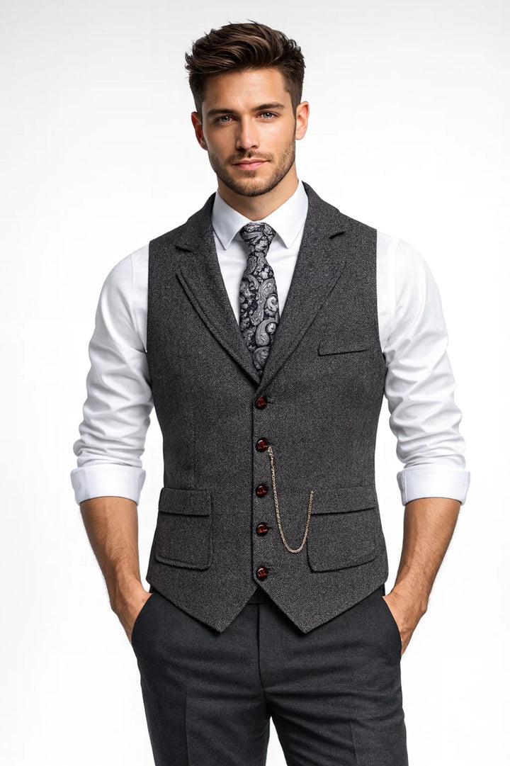 Dark blue men's tailored waistcoat with notch lapels, exquisite chain detail. Perfect sophisticated business attire or wedding wear.