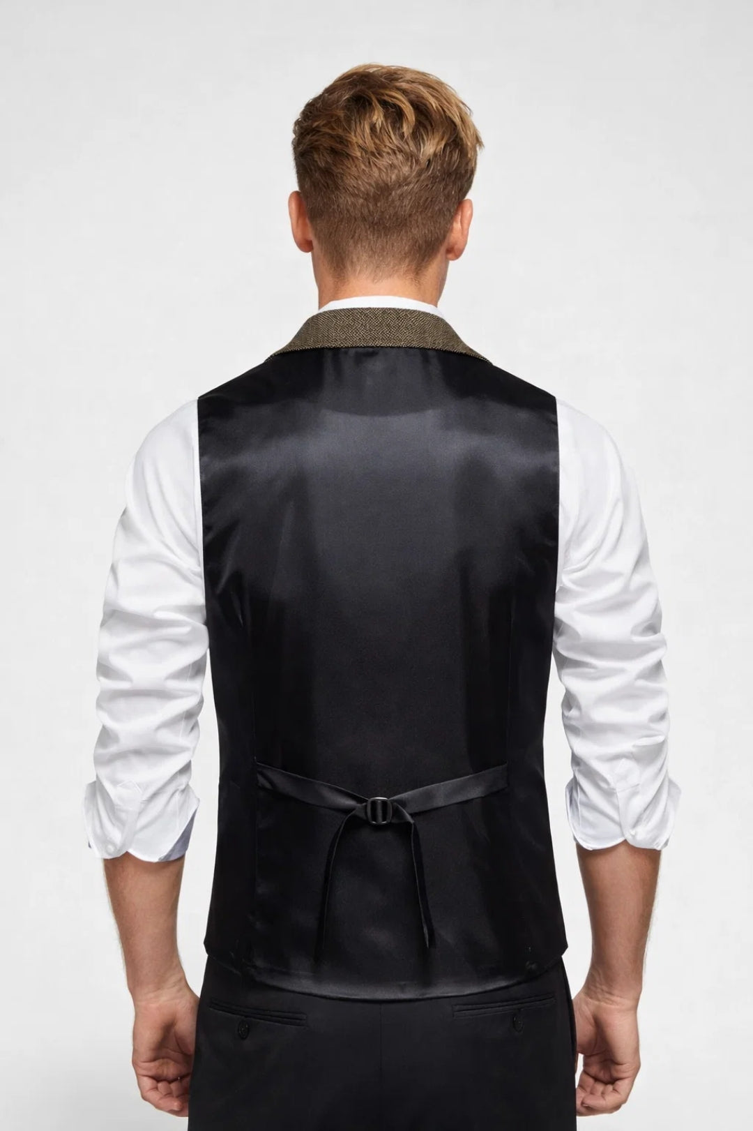 Grey men's tailored vest, elegant formalwear with notch lapels & chain detail. Great for business, weddings, or party outfits.