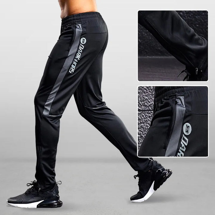 Men's sports pants: tapered joggers featuring secure zipper pockets for athletic performance and active wear.