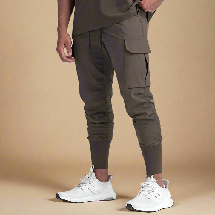 Casual men's quick-dry tapered cargo joggers. Athletic fit, comfortable multi-pocket track pants.