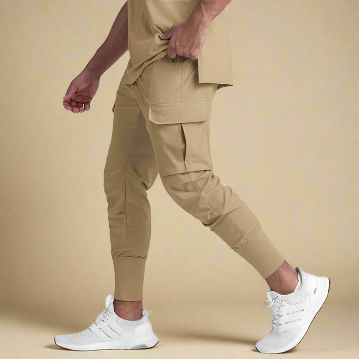 Durable men's quick-dry tapered cargo joggers. Multi-pocket design, comfortable athletic track pants.