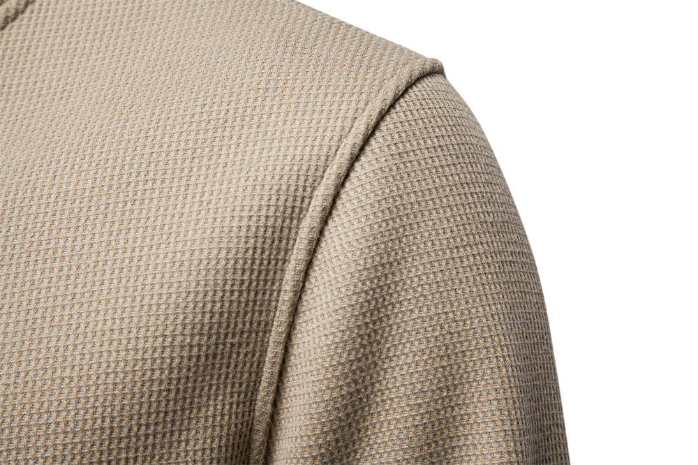 Modern men's textured henley sweatshirt, a versatile long sleeve top for autumn fashion.