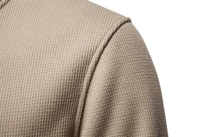 Modern men's textured henley sweatshirt, a versatile long sleeve top for autumn fashion.