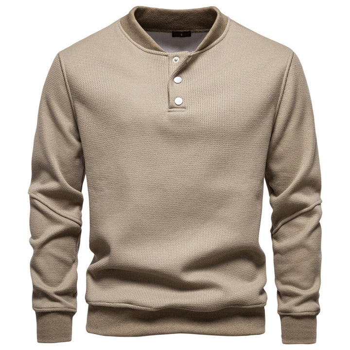 Comfortable men's henley sweatshirt with unique textured fabric, perfect for layering.