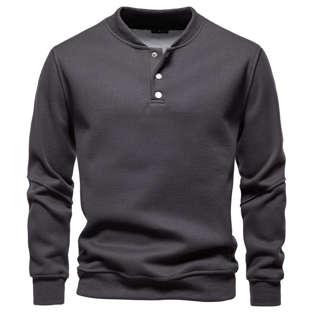 Versatile men's long sleeve textured henley sweatshirt in a cozy fabric for autumn.