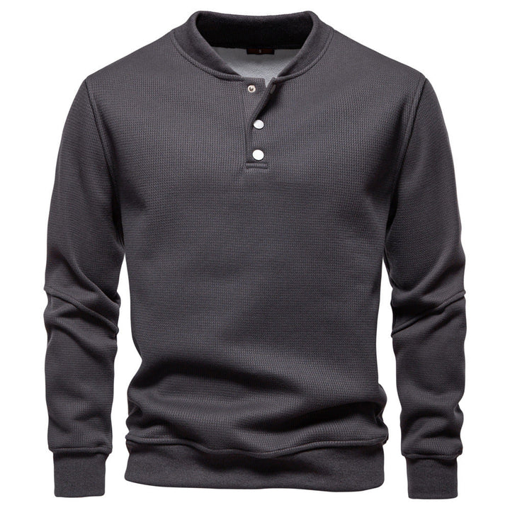 Versatile men's long sleeve textured henley sweatshirt in a cozy fabric for autumn.