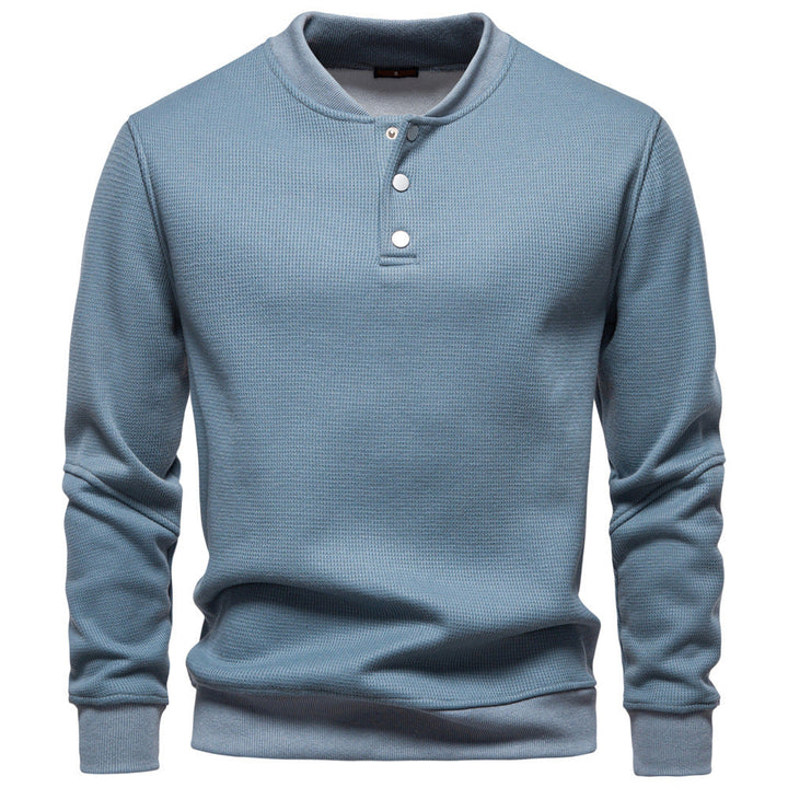 Cozy men's textured henley top, a comfortable long sleeve sweatshirt for versatile style.
