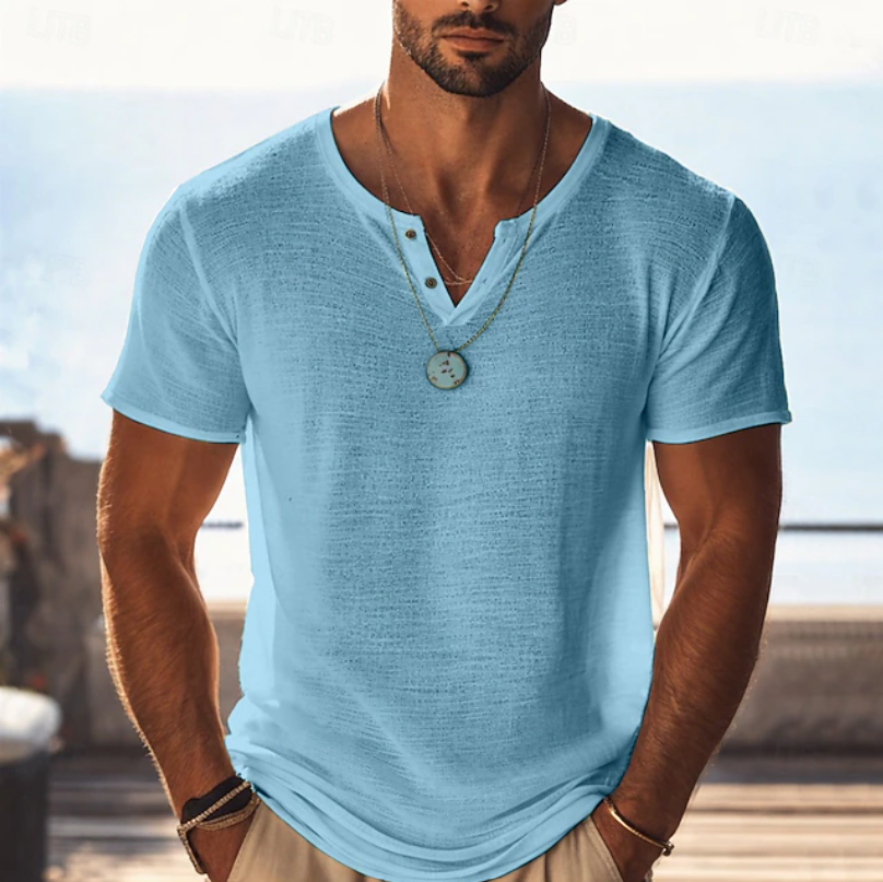 Man modeling a versatile men's textured Henley V-neck summer T-shirt, showcasing its relaxed fit and style.