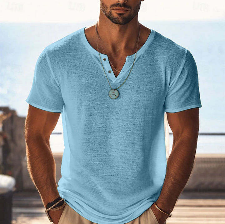 Man modeling a versatile men's textured Henley V-neck summer T-shirt, showcasing its relaxed fit and style.