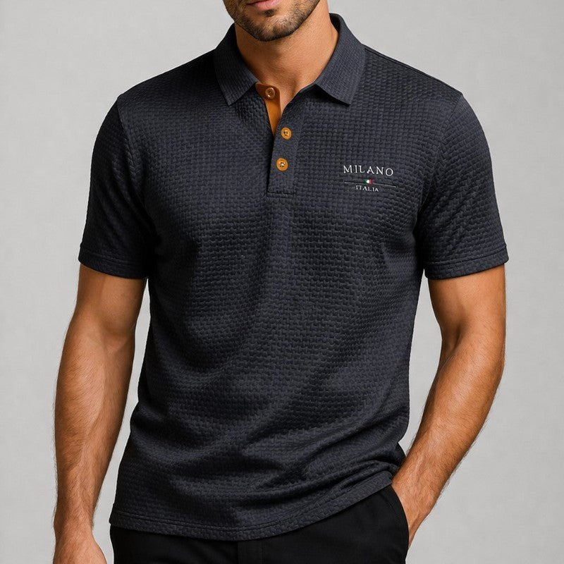 Modern men's fashion polo shirt featuring subtle embroidered detail, a sleek button placket, and comfortable texture.