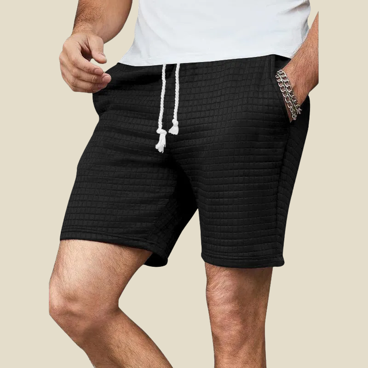Men's textured relaxed fit casual shorts with adjustable drawstring, perfect for everyday comfort.