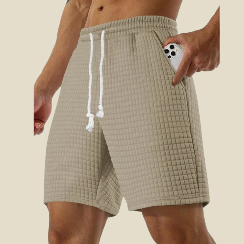 Textured men's relaxed fit shorts featuring an adjustable drawstring for all-day comfort and style.