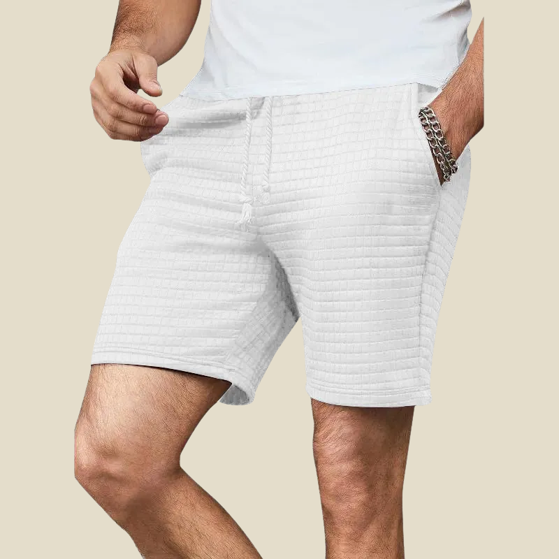 Stylish men's casual drawstring shorts in a textured fabric, offering a relaxed fit for versatile wear.