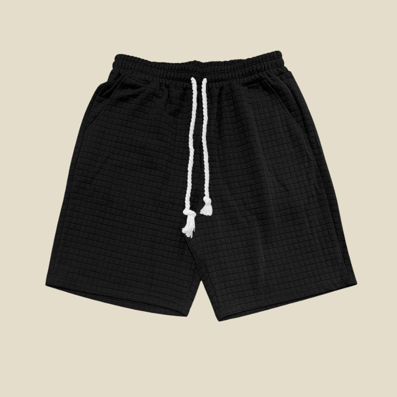 Relaxed fit men's casual shorts with textured fabric and drawstring, great for lounge wear & fashion.