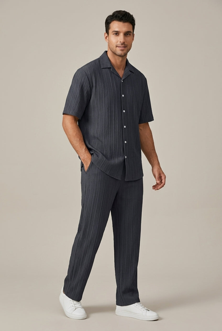 Men's fashion two-piece set: textured short sleeve top & casual drawstring trousers. Modern men's outfit set.