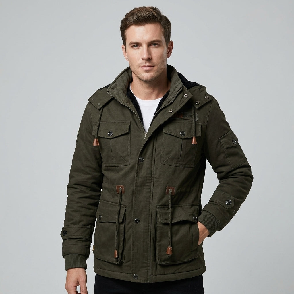 Men's cozy thermal hooded fleece jacket, perfect for cold weather. Offers warmth, comfort, and rugged outdoor style.