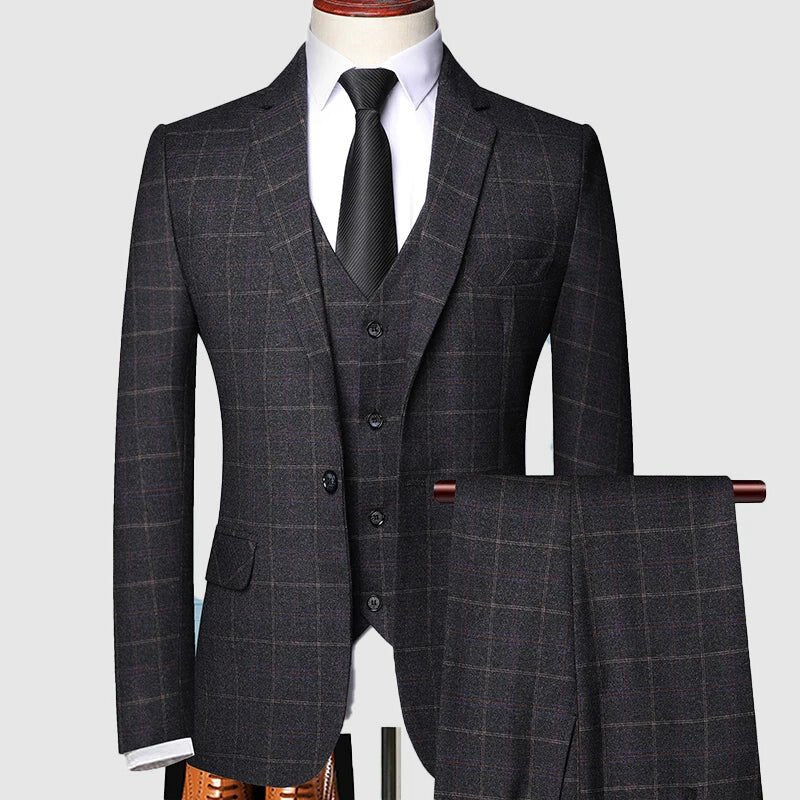Sophisticated men's three-piece formal suit featuring a stylish checked pattern. Tailored fit for a sharp, classic look.