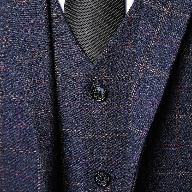 Men's formal three-piece suit with checked jacket, vest, and trousers. Perfect tailored business or wedding attire.