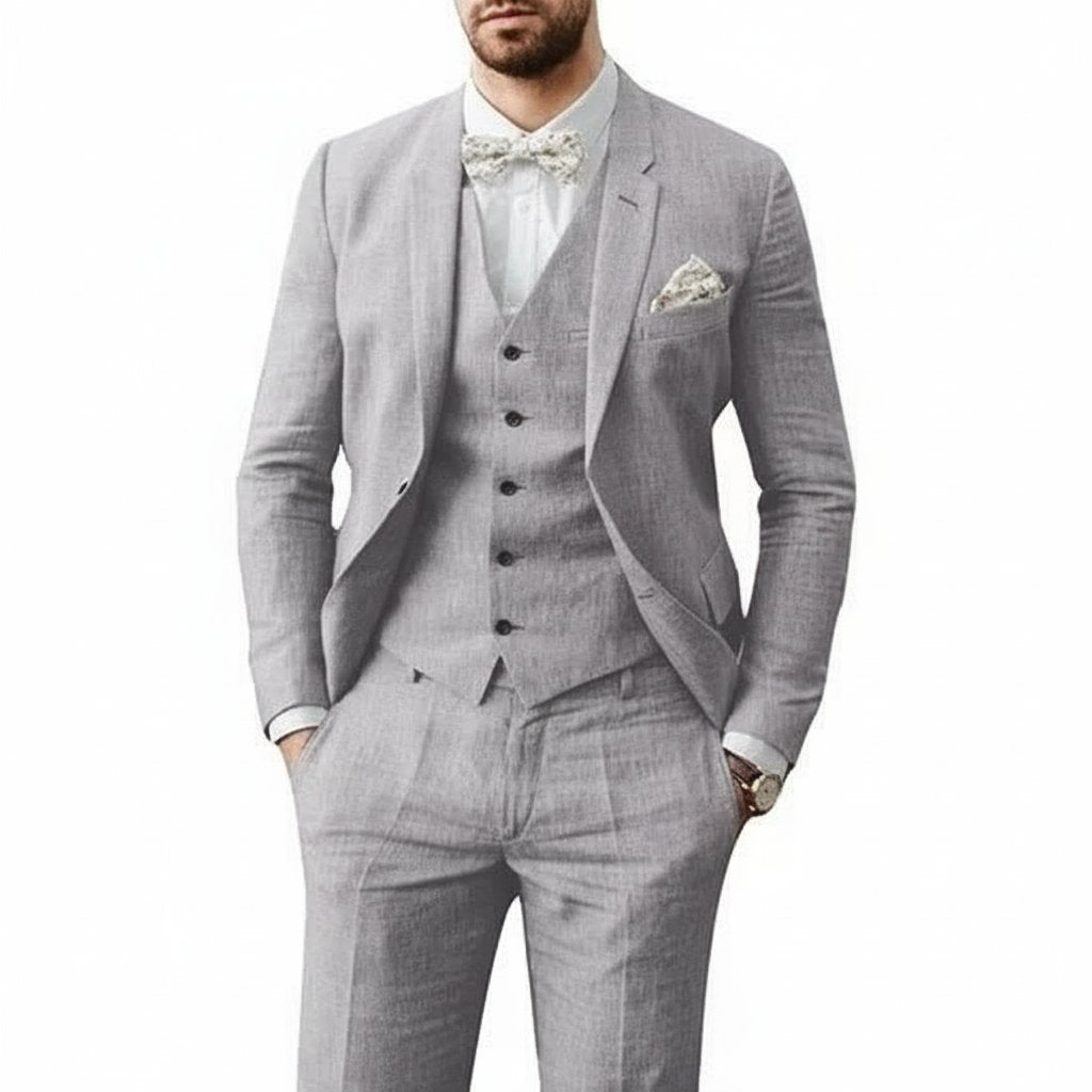 Sophisticated black three-piece men's suit, great for summer weddings & formal events.