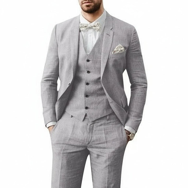 Sophisticated black three-piece men's suit, great for summer weddings & formal events.