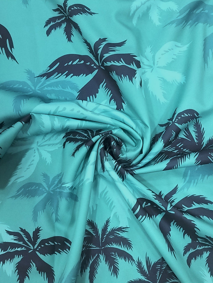 Stylish men's tropical palm tree print short-sleeve button-up shirt, perfect casual top for summer and vacation.