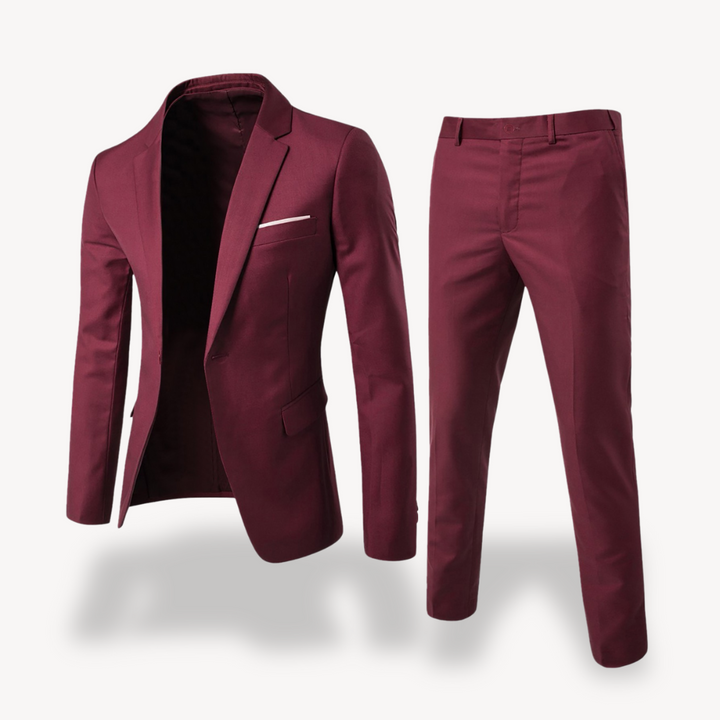 Stylish man wearing a professional two-piece formal suit, blazer & pants, ready for a special event.