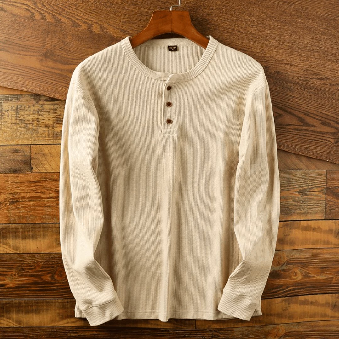 Comfortable long sleeve men's Henley top with buttons, ideal for casual fashion.