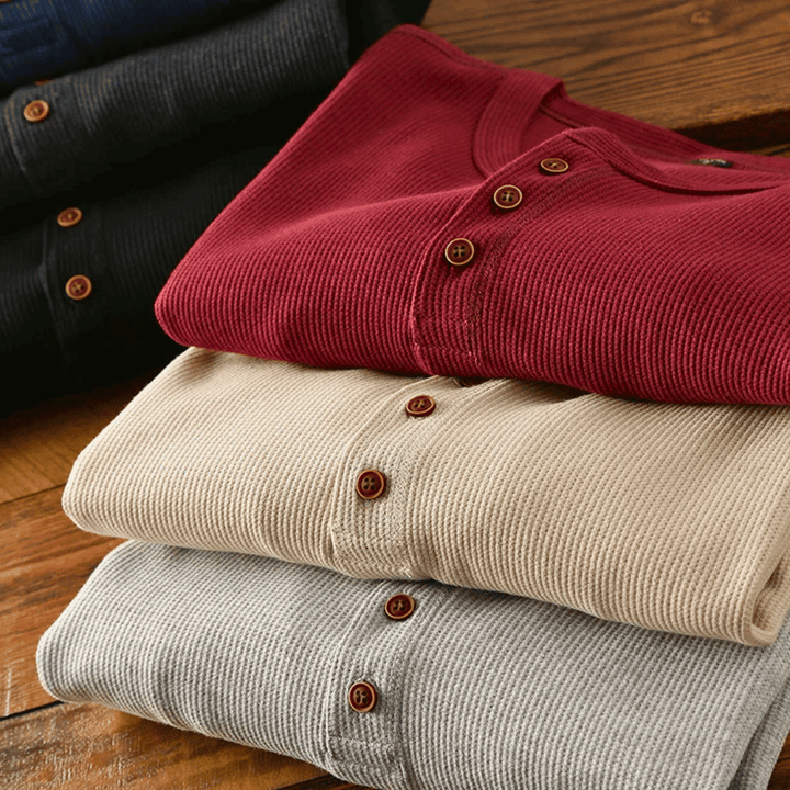 Comfortable & stylish men's long sleeve Henley top crafted from ultra-soft fabric.