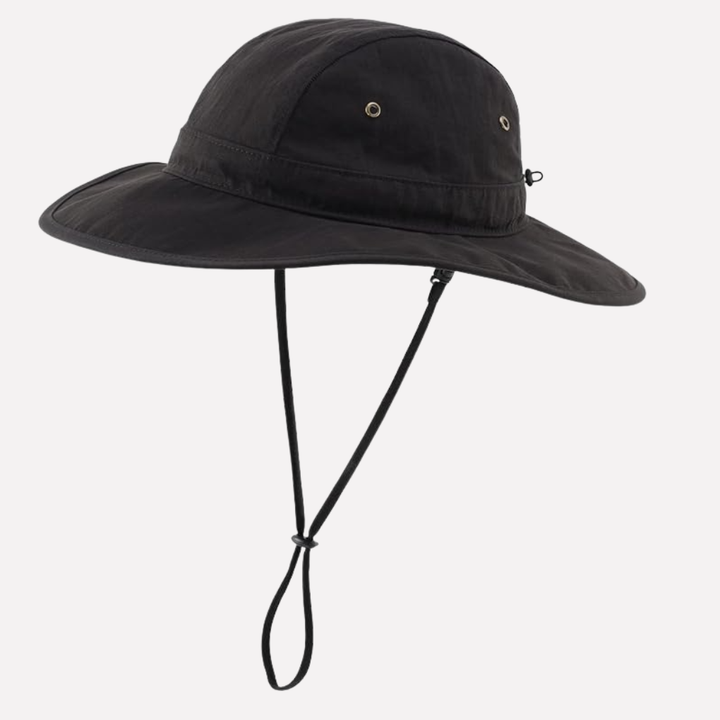 Stylish men's bucket sun hat with wide brim & UPF 50+, ideal for beach, travel, and outdoor wear.