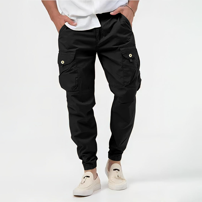 Functional men's streetwear joggers, cargo style with spacious pockets & elastic cuffs, great for urban exploration.