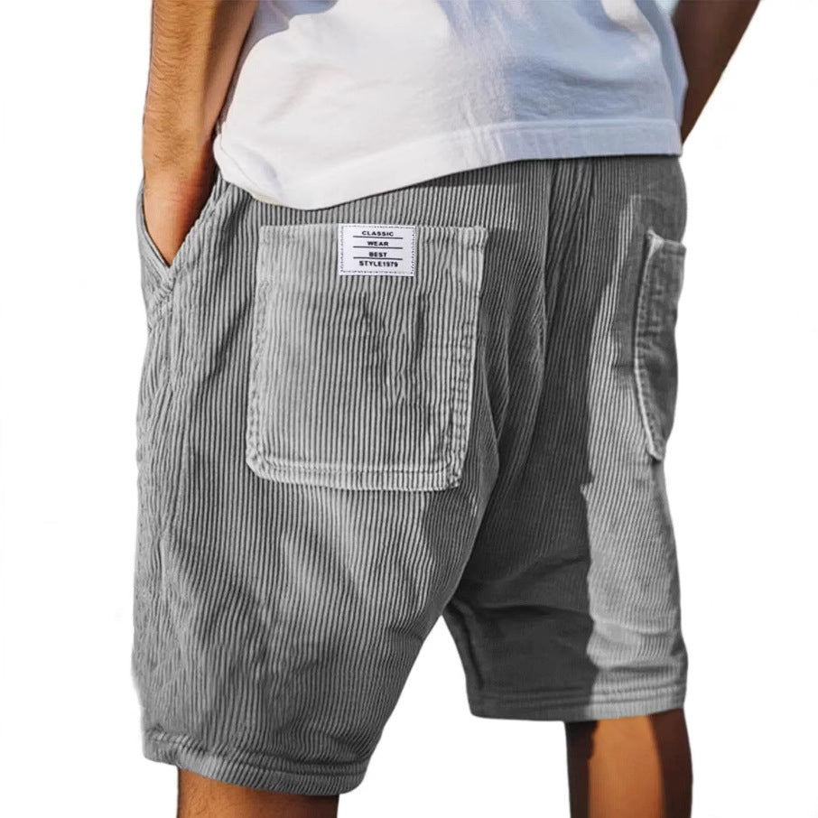 Men's urban casual shorts with elastic waistband, comfortable for streetwear and summer style.