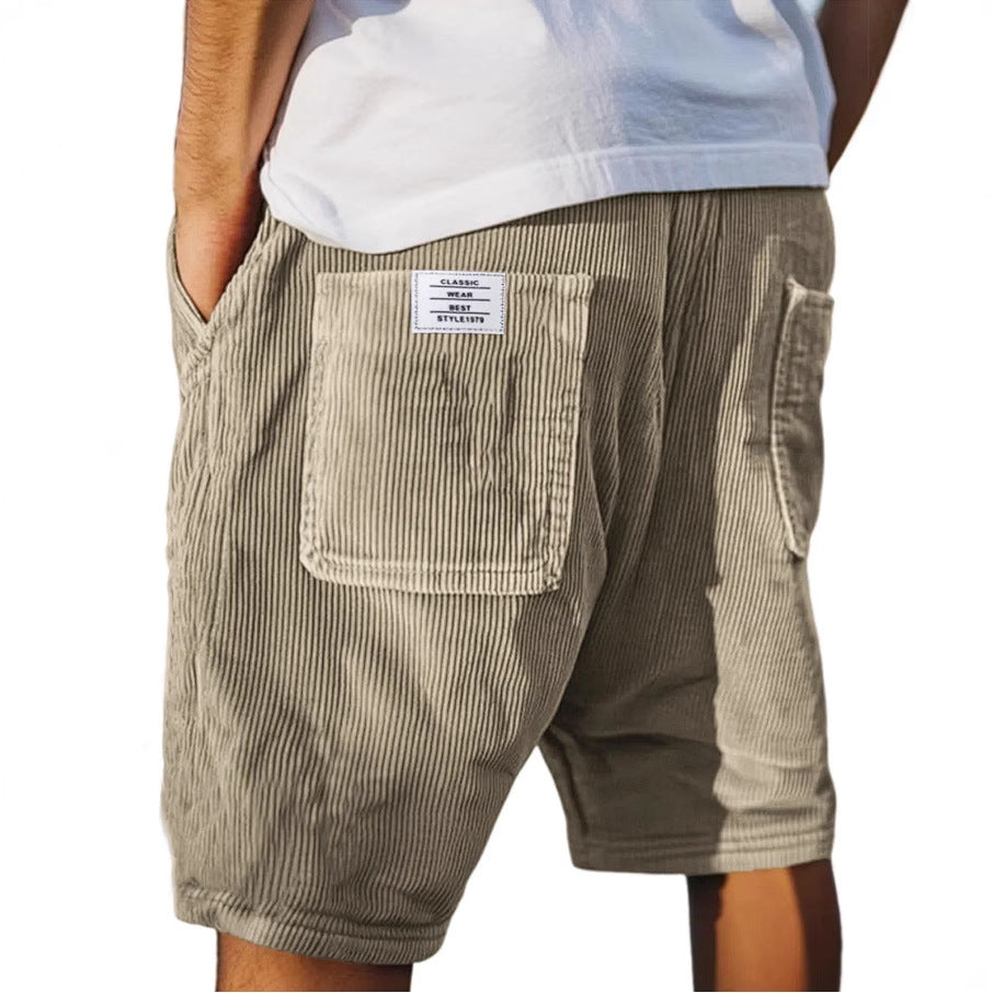 Textured men's casual shorts, elastic waist & patch pocket. Urban style, comfortable summer wear.
